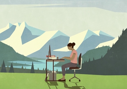 Businesswoman working at desk in idyllic mountain meadow