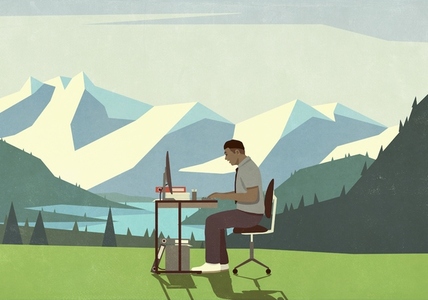 Businessman working at desk in idyllic mountain meadow