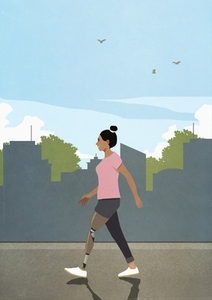 Woman with prosthetic leg walking on city sidewalk