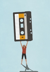 Woman holding large cassette tape overhead