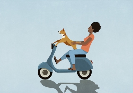 Carefree woman with dog driving motor scooter
