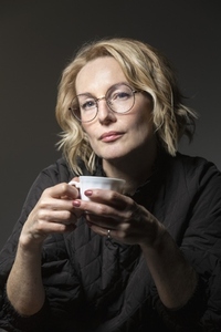 Portrait confident blonde woman drinking coffee