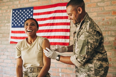 American servicewoman getting inoculated against covid 19