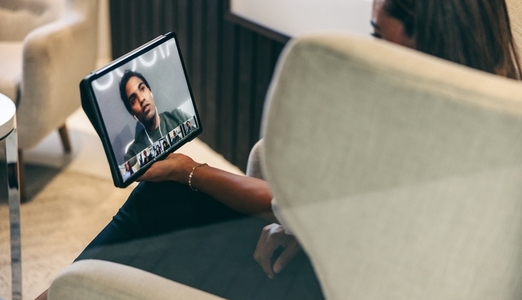 Black businesswoman attending a video conference in an office