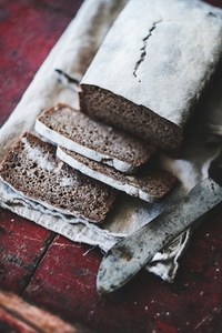 Rye Swedish bread loaf cut in slices with vintage knife