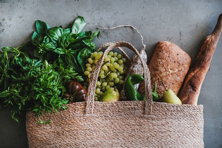 Flat lay of healthy shopping bag with fresh vegetables and fruits