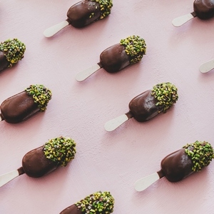 Chocolate glazed ice cream pops with pistachio icing  square crop