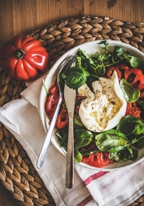 Italian salad with Buratta cheese  tomatoes  arugula and fresh basil