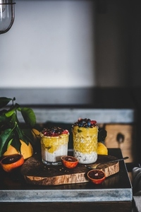Muesli with mango smoothie  buckwheat granola and berries  copy space
