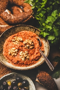 Turkish red pepper paste with walnuts  simit bagels  fresh parsley
