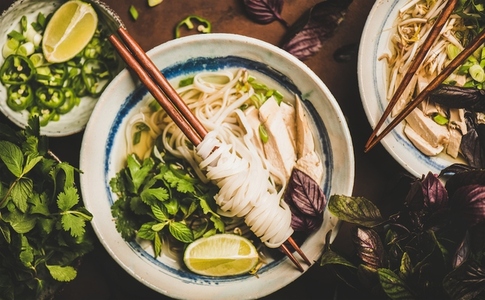 Flat lay of Vietnamese rice noodle and chicken soup Pho Ga
