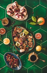 Turkish traditional lokum with coffee over green tile table