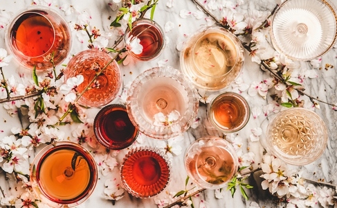 Flat lay of rose wine in different colors in glasses
