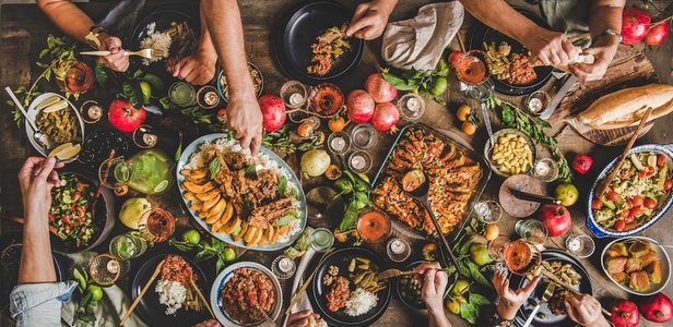 Flat lay of family feasting with Turkish cuisine foods  wide composition