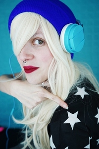 Beautiful blonde woman listening to music