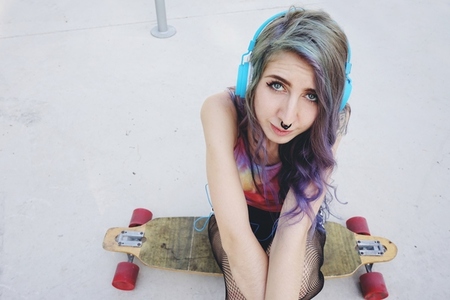 Teenager skater woman at a skate park