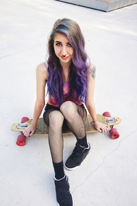 Teenager skater woman at a skate park