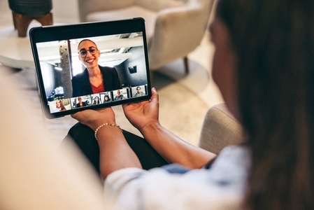 Businesswoman attending a virtual meeting with her global partners