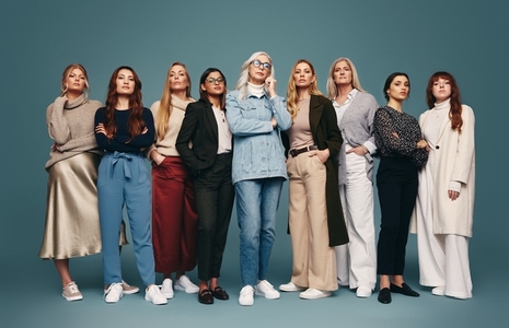Diverse group of women standing together in a studio