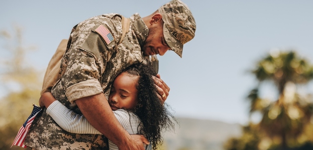 Affectionate military reunion between father and daughter