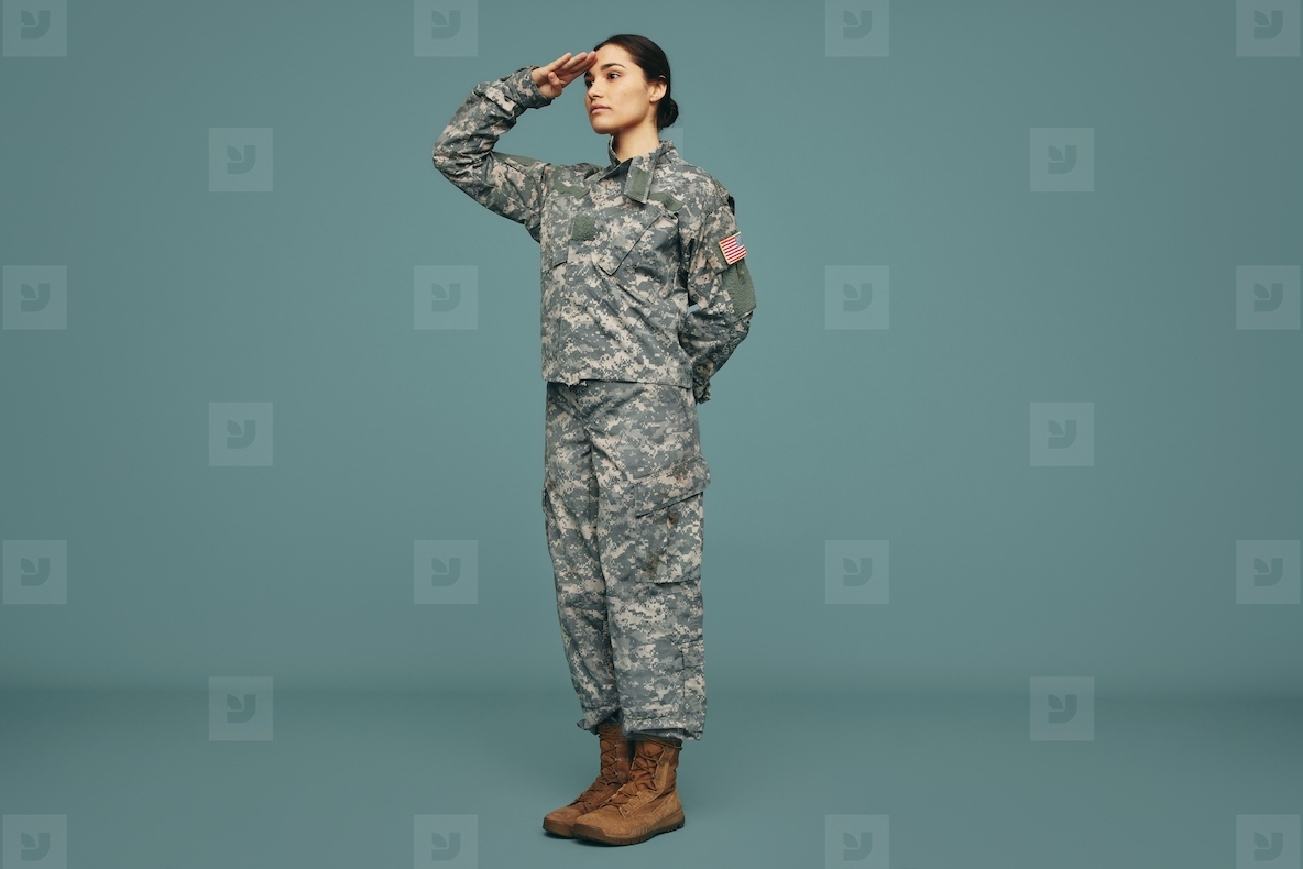 American soldier saluting in a studio
