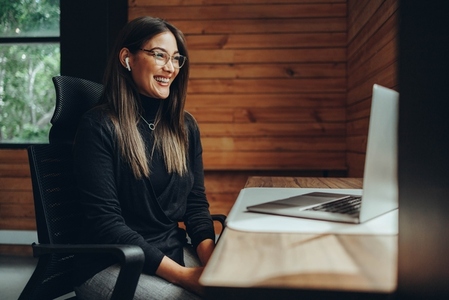 Female entrepreneur having an online meeting in a coworking space