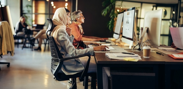 Muslim designer working in a coworking office