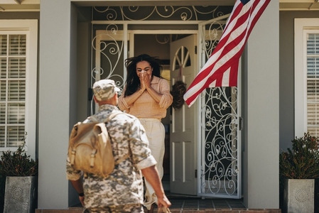 Army soldier surprising his wife with his homecoming