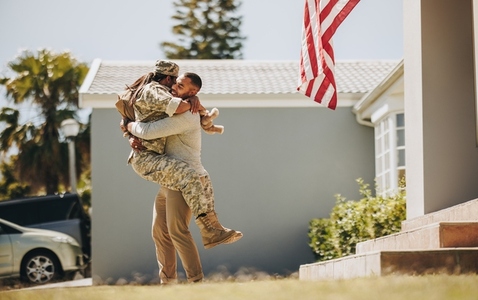 American soldier reuniting with her husband at home