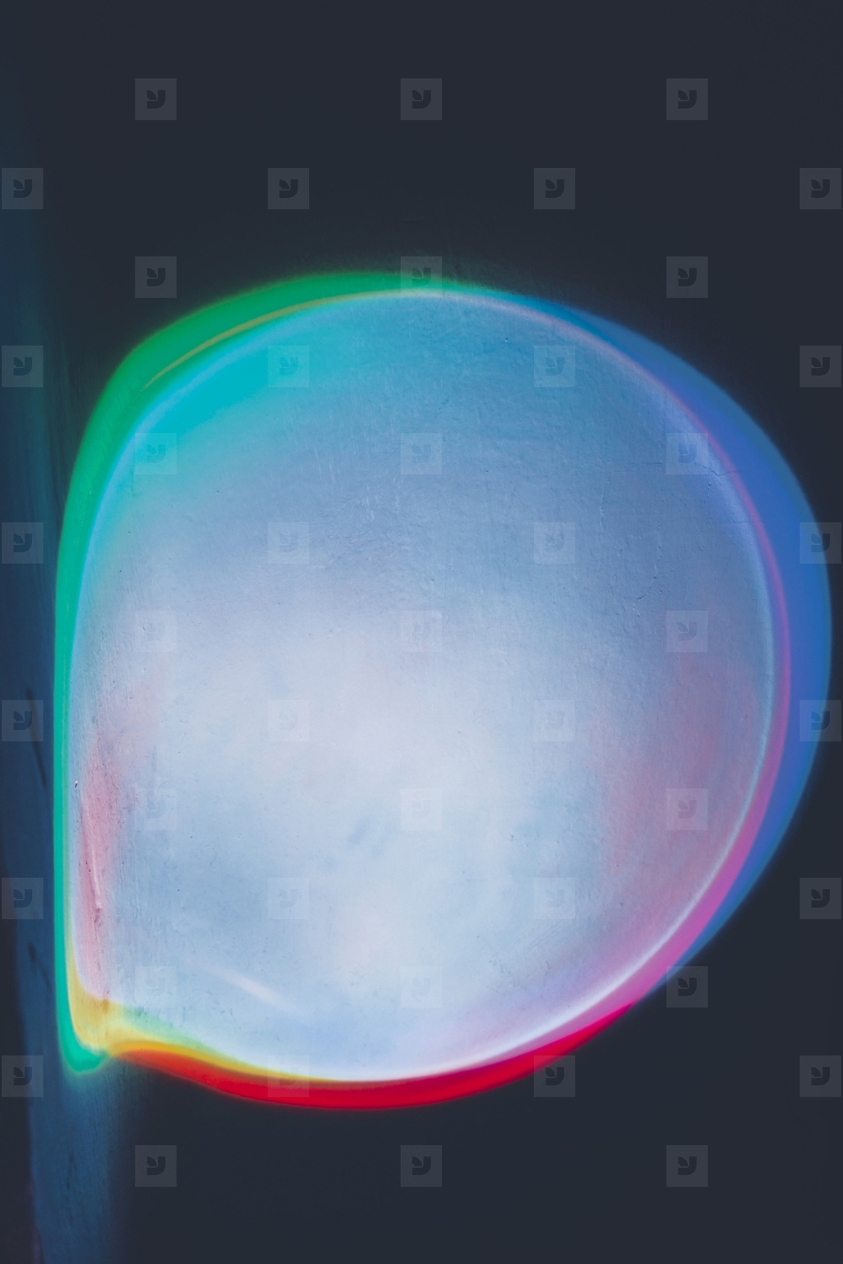 Abstract image of colorful shapes of light against black backgro