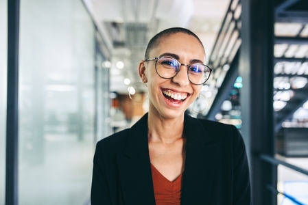 Successful young businesswoman smiling cheerfully