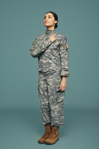 American servicewoman swearing an oath in a studio