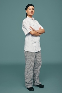Professional cook standing in a studio