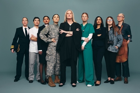 Empowered female workers standing together in a studio