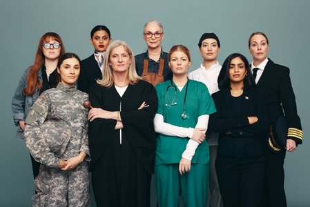 Portrait of different female workers standing in a studio