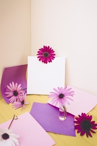 Mockup image with a white canvas surrounded by color papers and