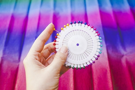 close up of a Rainbow and colorful circle made by pins