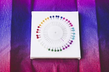 close up of a Rainbow and colorful circle made by pins