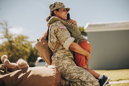 Joyful military mom reuniting with her son at home