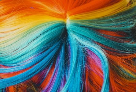Close up of a multi colored rainbow wig