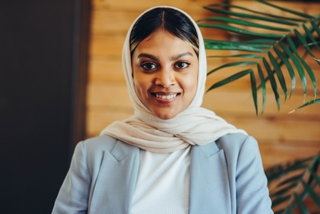 Portrait of a Muslim businesswoman wearing a hijab in an office