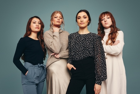 Group of independent women standing together in a studio