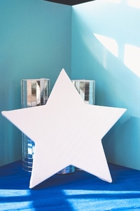 White star shape mockup with a cinematic atmosphere in blue tone