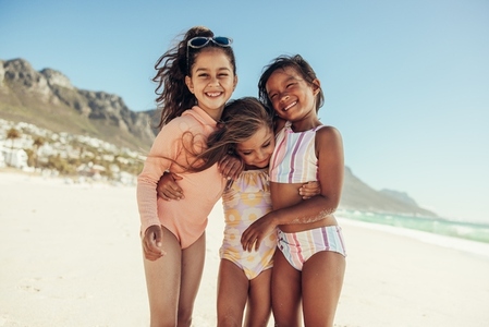 Adorable little girls having fun at the beach