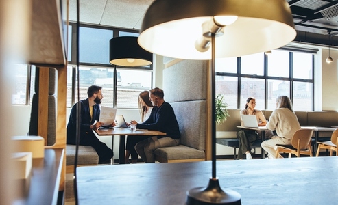 Businesspeople working in a modern co working space