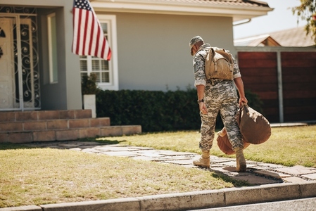 Patriotic American soldier returning home from the army