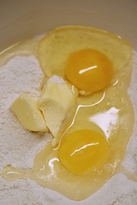 Close up eggs butter and flour baking ingredients