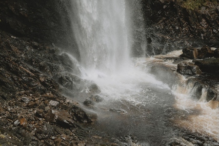Waterfall splashing over rugged rocks