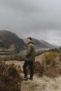 Man hiking in tranquil Scottish Highlands