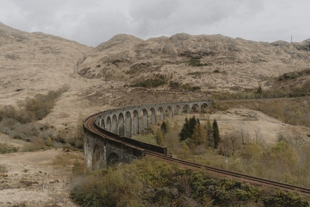 Curving railway viaduct in rugged